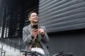 Happy employee environment lover calling colleagues before staff meeting. Cheerful businessman with glasses on reading text Royalty Free Stock Photo