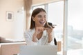 Happy employee woman talking at speaker on cellphone at home Royalty Free Stock Photo