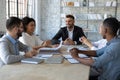 Positive young office workers having a meeting