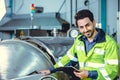 Happy engineer male worker working in factory work check boiler water pipe in factory, portrait smile Royalty Free Stock Photo