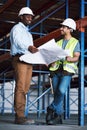 Happy engineer people, blueprint and meeting for construction, planning or team strategy on site. Architect men in Royalty Free Stock Photo