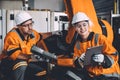 Happy engineer team working in modern automation factory with welding robot arm control training operation. women worker machine Royalty Free Stock Photo