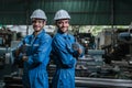 Happy engineering man industrial workers thumbs up wearing uniform safety in factory.