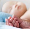 Happy and enjoy Portrait of a newborn Asian baby boy on the bed ,a dummy in his mouth, Charming Royalty Free Stock Photo