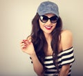 Happy enjoyment young woman in sun glasses and blue baseball cap Royalty Free Stock Photo