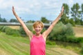 Happy enthusiastic woman rejoicing the summer sun