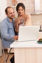 Happy entrepreneur couple working on laptop Royalty Free Stock Photo