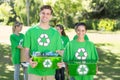 Happy environmental activists in the park with recyclables