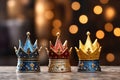 Happy Epiphany day. Three royal crowns on golden bokeh background