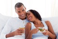 Happy ethnic couple drinking a cup of tea Royalty Free Stock Photo