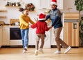 Happy ethnic family dad and children brother and sister have fun on Christmas day at home Royalty Free Stock Photo