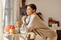 Happy ethnic family mother and son hugging in the kitchen at home