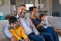 Happy ethnic family watching television together Royalty Free Stock Photo