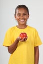 Happy ethnic school girl 10 holding red apple Royalty Free Stock Photo