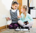 children playing with sockets and electricity indoors Royalty Free Stock Photo