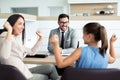 Happy and excited family celebrating just bought a new car from dealership Royalty Free Stock Photo