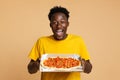 Happy Excited Black Guy Holding Opened Box With Tasty Italian Pizza Royalty Free Stock Photo