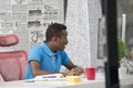 Happy excited businessman celebrate his success. Winner, black man in office reading on laptop, copy space Royalty Free Stock Photo