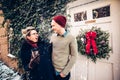 Happy excited caucasian couple having fun together outdoors at Christmas time
