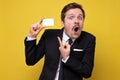 Happy excited caucasian man showing blank credit card pointing at it Royalty Free Stock Photo