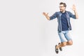 Happy excited cheerful young man jumping and celebrating success isolated on a white background Royalty Free Stock Photo