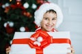 Happy excited child holding christmas gift box