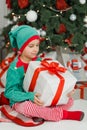 Happy excited child holding christmas gift box Royalty Free Stock Photo