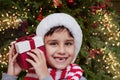 Happy excited child holding christmas gift box Royalty Free Stock Photo