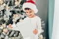 Happy excited child holding christmas gift box Royalty Free Stock Photo