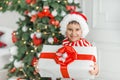 Happy excited child holding christmas gift box Royalty Free Stock Photo