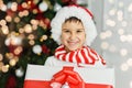 Happy excited child holding christmas gift box Royalty Free Stock Photo