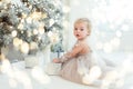 Happy excited child holding christmas gift box. Royalty Free Stock Photo