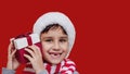 Happy excited child holding christmas gift box Royalty Free Stock Photo