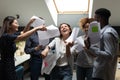 Happy excited diverse employees dancing with documents, celebrating success Royalty Free Stock Photo