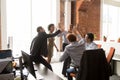 Happy excited diverse employees giving high five at briefing Royalty Free Stock Photo