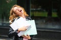 Happy excited emotional girl with shopping bags outside. Crazy woman has a great shopping time. Best seasonal sales. Black friday Royalty Free Stock Photo