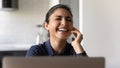 Happy excited Indian student girl laughing at laptop