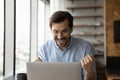 Happy excited laptop user getting amazing good news Royalty Free Stock Photo