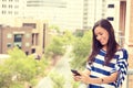 Happy excited laughing woman texting on mobile phone Royalty Free Stock Photo