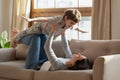 Happy excited little child boy playing airplane with mom. Royalty Free Stock Photo