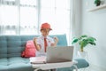 excited primary school student with uniform raise her arm during online class Royalty Free Stock Photo