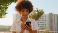 Happy excited satisfied African American businesswoman winner successful girl business woman outdoors in city read good Royalty Free Stock Photo