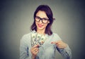 Happy excited successful business woman holding money dollar bills in hand Royalty Free Stock Photo