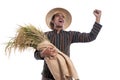 Happy excited traditional farmer with hand raised holding rice