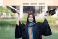 A happy and excited young Asian female university graduate Royalty Free Stock Photo