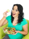 Happy Excited Young Woman Eating a Fresh Crisp Mixed Garden Salad Royalty Free Stock Photo