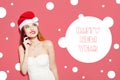 Happy Excited Young Woman In Santa Claus Hat Thinking Over Pink Background. Cute Girl In White Dress. Long Hair And Red Lips. Happ