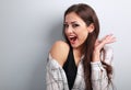 Happy excited young woman screaming with open mouth on blue back Royalty Free Stock Photo