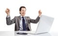 Happy executive man looking a laptop computer with arms raised i Royalty Free Stock Photo