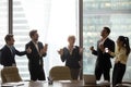 Happy executive team dancing to music having fun in office Royalty Free Stock Photo